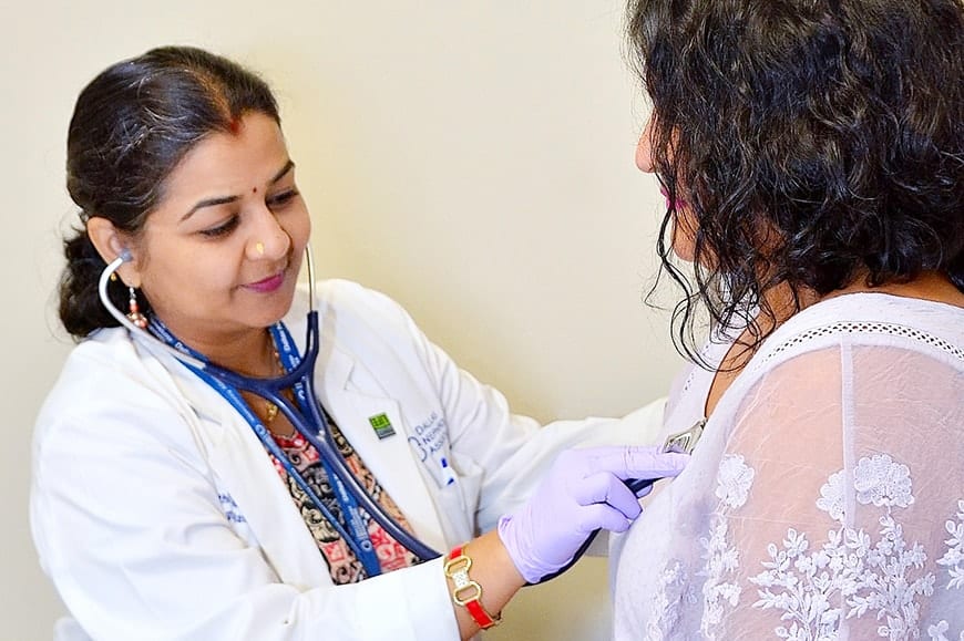 A doctor examining a patient