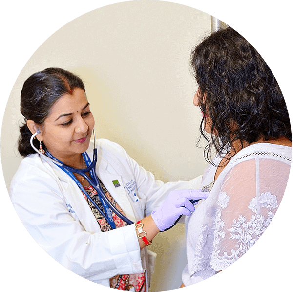 A kidney transplant doctor examining a patient with chronic kidney disease